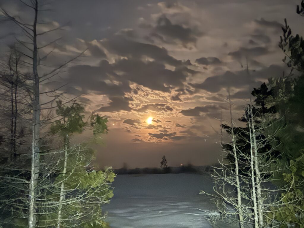 An orange moon out at our farthest net.